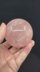 Rose Quartz Sphere on Gold Stand 370g- “I radiate love, beauty, confidence and grace”.